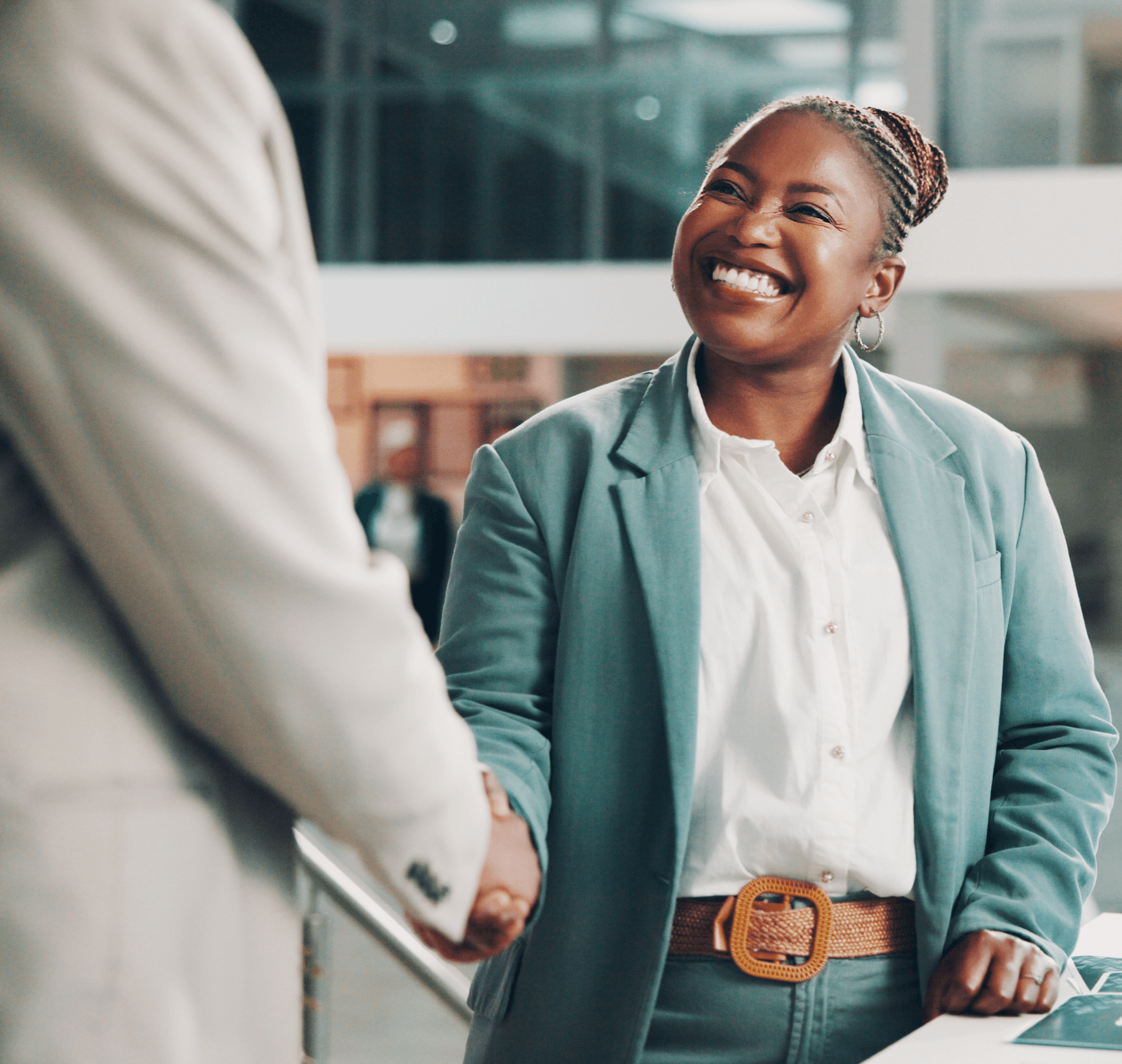 A professional sealing her new role with a handshake