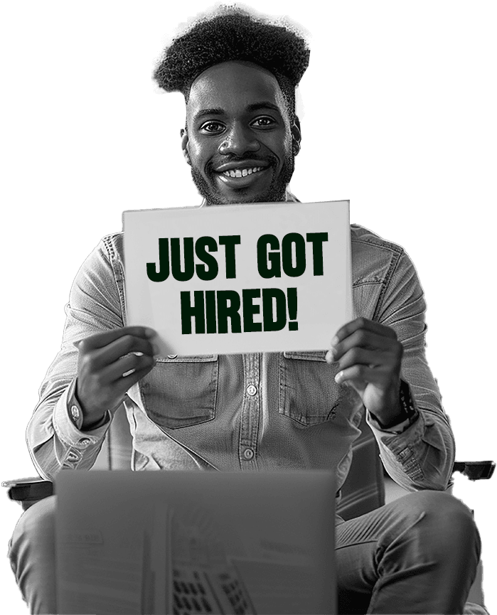 A DotNexxt graduate holding a “Just got hired!” sign